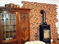 Immitation von einer verklinkerten Wand mit braunroten Klinkern